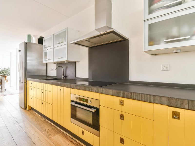 pretty-kitchen-with-yellow-kitchen-unit-and-hangin-2021-12-09-14-14-18-utc.jpg